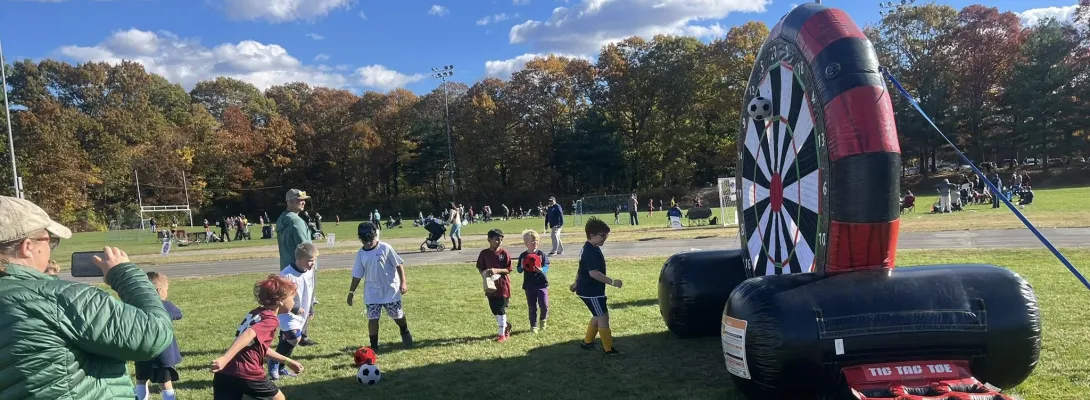 Medway Youth Soccer Day kid playing with velcro soccer ball target