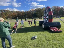 Medway Youth Soccer Day kid playing with velcro soccer ball target