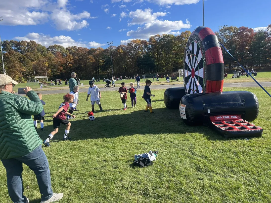 Medway Youth Soccer Day kid playing with velcro soccer ball target
